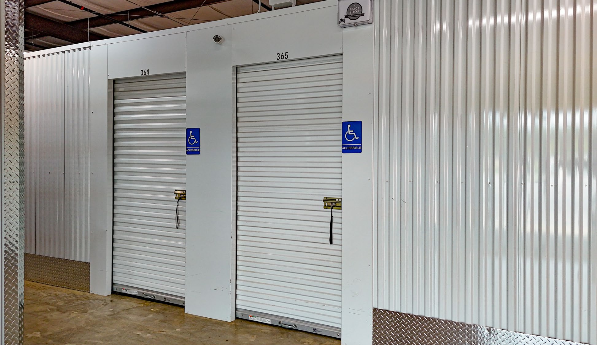 Interior climate-controlled storage corridor with roll-up unit doors